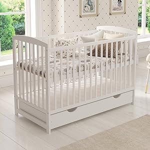 white baby cot bed