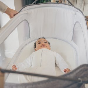 Smiling baby in NiniPod