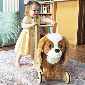 Toddler pushing baby walker toy